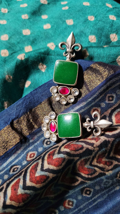Side view of Vasant Earrings in pure silver with handcrafted detailing