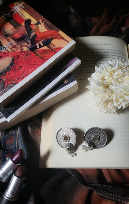 Side view of Vasu Earrings in pure silver with handcrafted detailing
