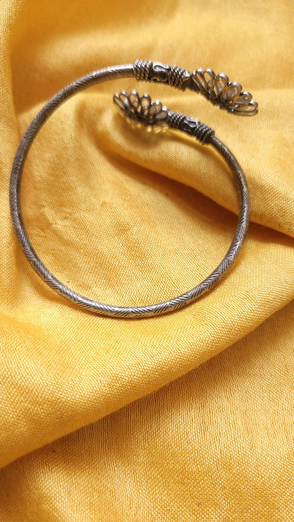 Side view of Victoria Kada in pure silver with handcrafted detailing