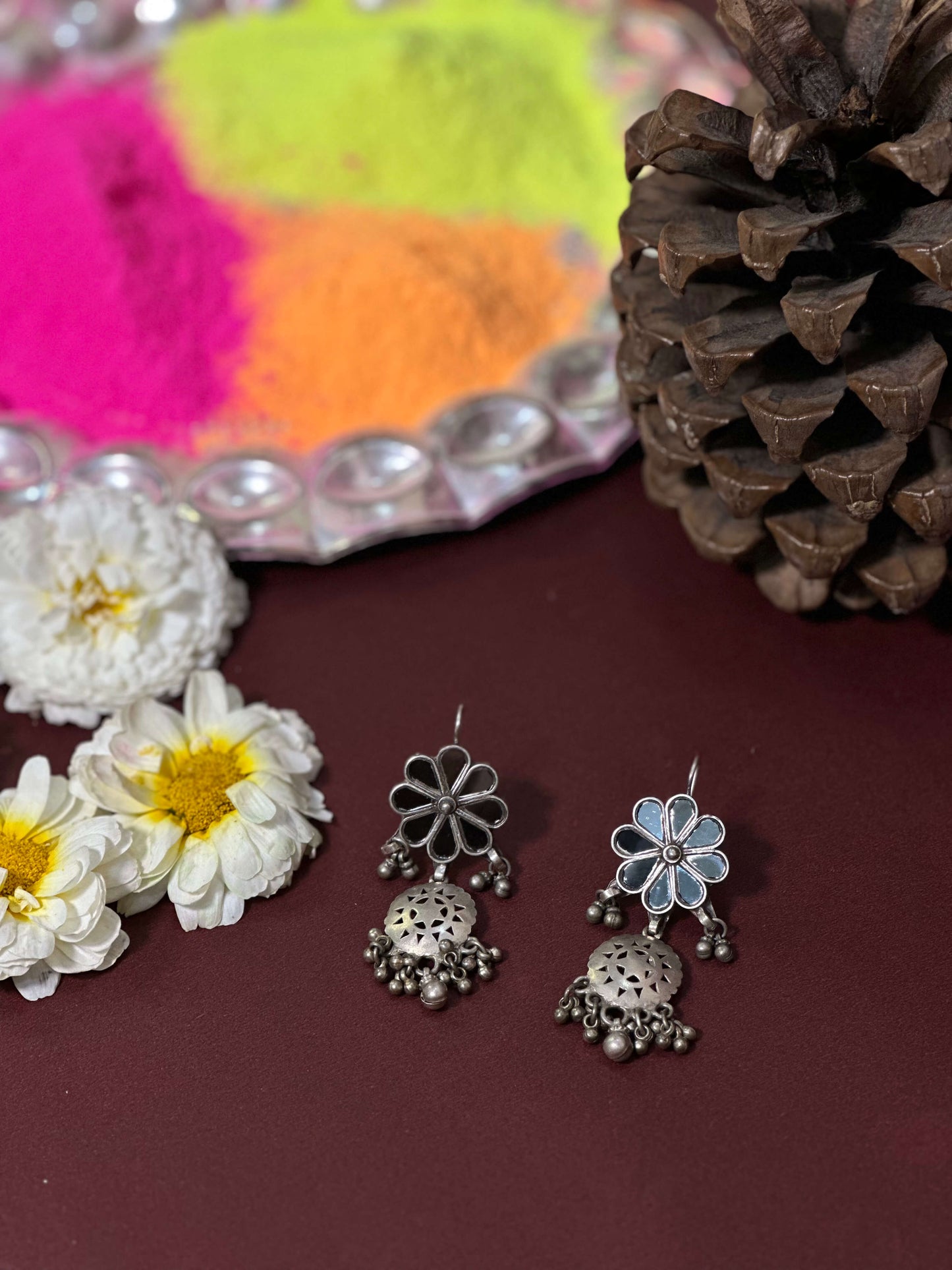 Side view of Vrushali Vintage Earrings in pure silver with vintage detailing