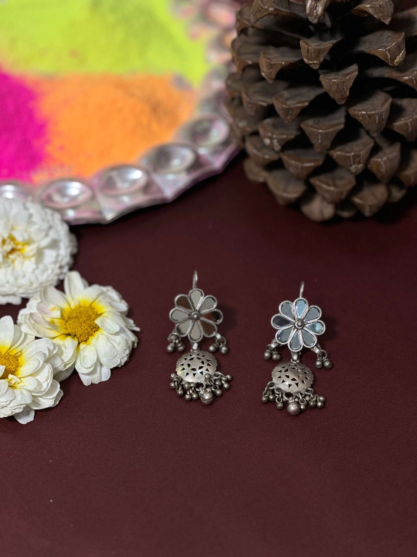 Side view of Vrushali Vintage Earrings in pure silver with vintage detailing