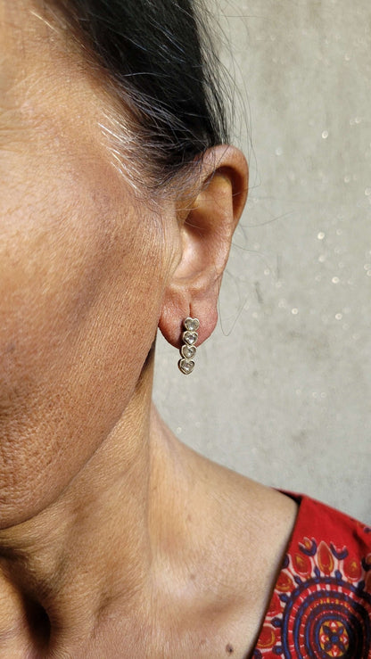 Side view of Yaarana Studs in pure silver with handcrafted detailing